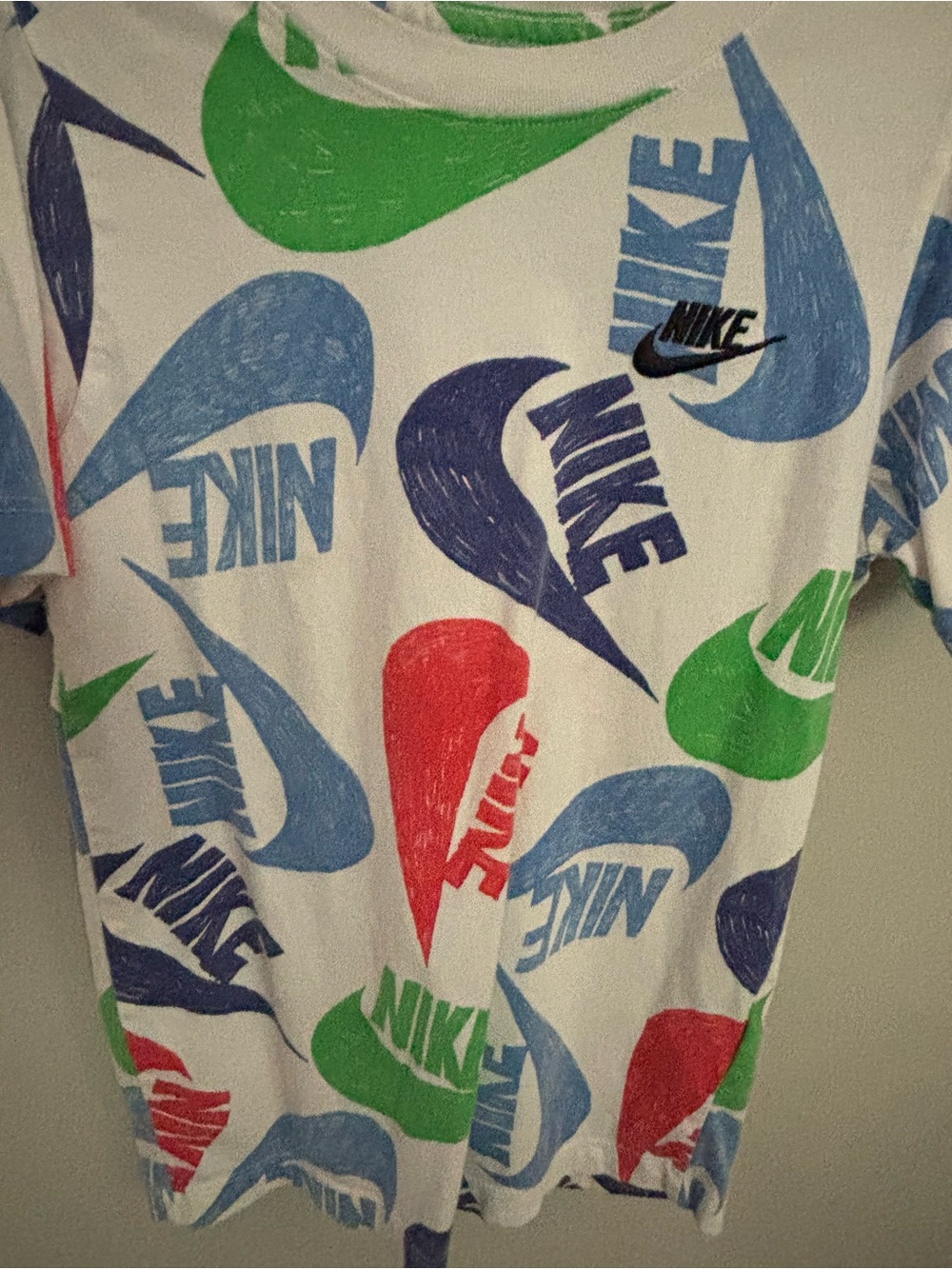 Kids Nike All-Over Swoosh Logo Tee — White with Blue, Green & Red Swooshes